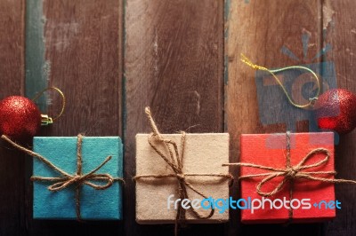 Box With Multicolored On Wooden Stock Photo