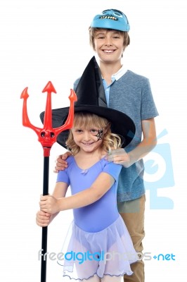 Boy And Girl Wearing Halloween Costume Stock Photo