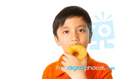 Boy Eating A Donut Stock Photo