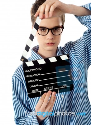 Boy Holding Clapperboard Stock Photo