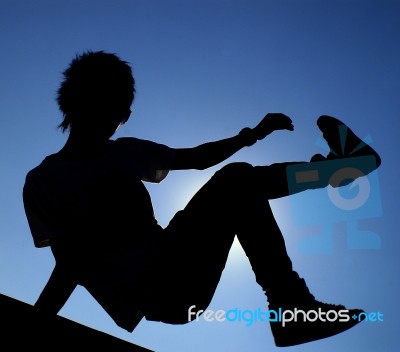 Boy Jumping Silhouette Stock Photo