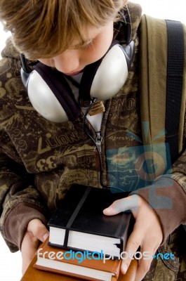 Boy Looking Books With Headphone Stock Photo