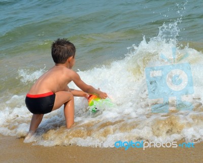 Boy On The Beach Stock Photo