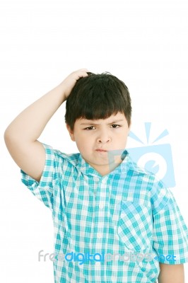 Boy Scratches His Head Stock Photo