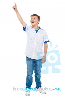 Boy Showing Pointing Upwards Stock Photo
