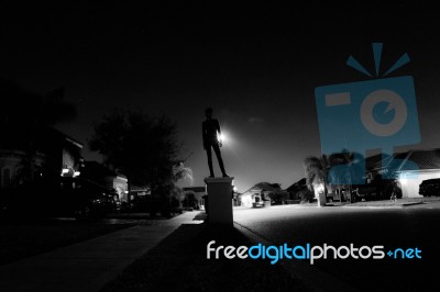 Boy Standing On A Mailbox At Night Stock Photo