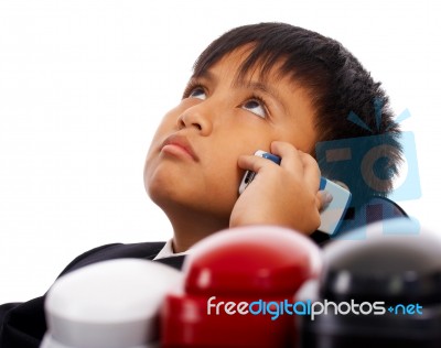 Boy With Many Telephones Stock Photo