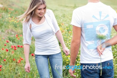 Boyfriend Hiding A Flower Stock Photo