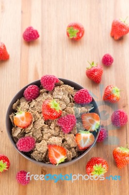 Bran Flakes With Fresh Raspberries And Strawberries Stock Photo