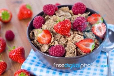 Bran Flakes With Fresh Raspberries And Strawberries Stock Photo