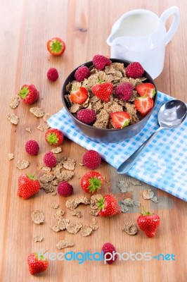 Bran Flakes With Fresh Raspberries And Strawberries And Pitcher Stock Photo