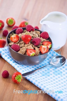 Bran Flakes With Fresh Raspberries And Strawberries And Pitcher Stock Photo