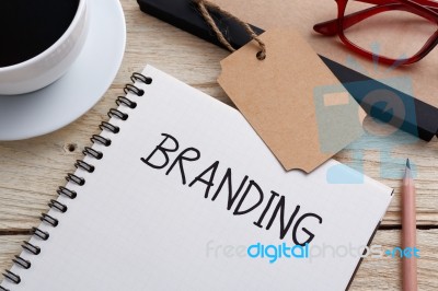 Branding Concept With Tag On Work Desk Stock Photo