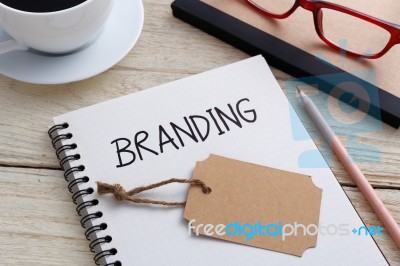 Branding With Notebook And Brand Tag Stock Photo Branding With Notebook And Brand Tag Stock Photo