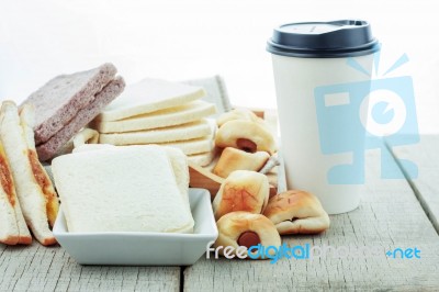 Bread And Coffee On Wooden Stock Photo