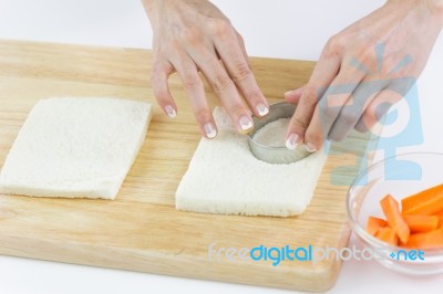 Bread Cut Into Circle Shape On White Plate With Women Hands Work… Stock Photo