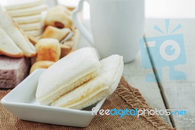 Bread In Saucer On Table Stock Photo
