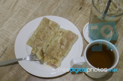 Breakfast Set Of Coffee Drink And Fried Ham Cheese Roti Stock Photo