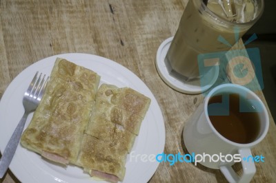 Breakfast Set Of Coffee Drink And Fried Ham Cheese Roti Stock Photo