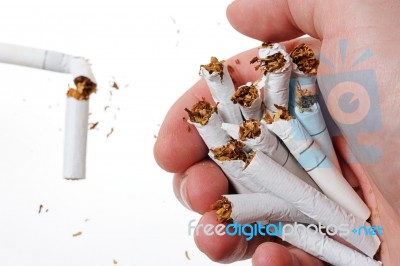 Broken Cigarette In Hand Stock Photo