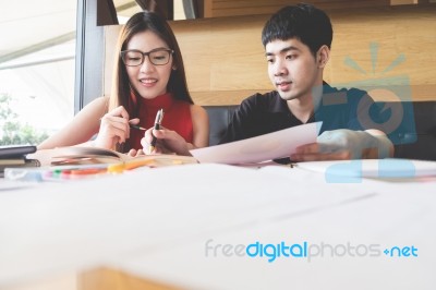 Brother Helps Her Sister To Do Their Homework Stock Photo