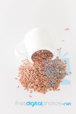 Brown Flax Seed On Clean Kitchen Table Stock Photo