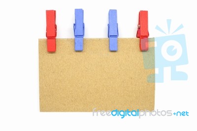 Brown Notepad With Colorful Clip On White Background Stock Photo