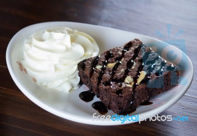 Brownie Cake With Whipped Cream Stock Photo