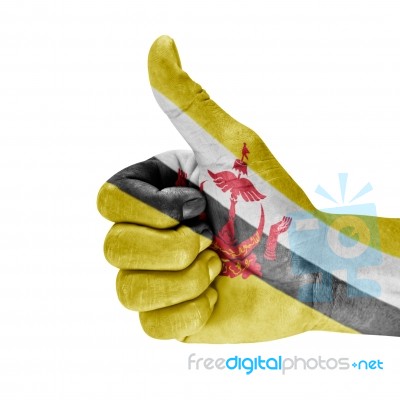 Brunei Flag On Thumb Up Hand Stock Photo