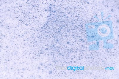 Bubble Foam Soap In Blue Water Stock Photo