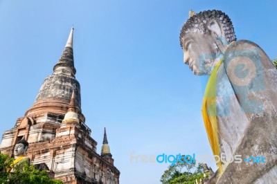 Buddha Statue And Ancient Pagoda Stock Photo