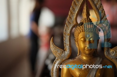 Buddha Statue And Donate Coins Stock Photo