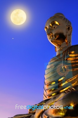Buddha Statue Under The Full Moon Stock Photo