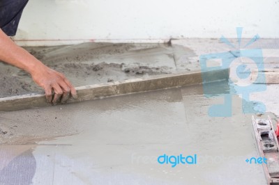 Builder Worker Plastering Concrete At Floor Stock Photo