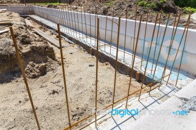 Building Site With Iron Bars In Concrete Foundation Stock Photo