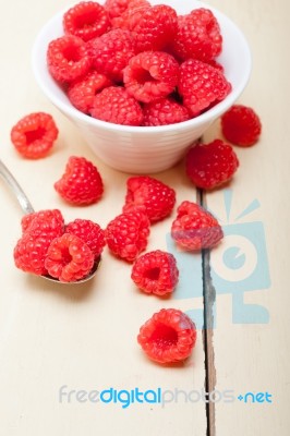 Bunch Of Fresh Raspberry On A Bowl And White Table Stock Photo