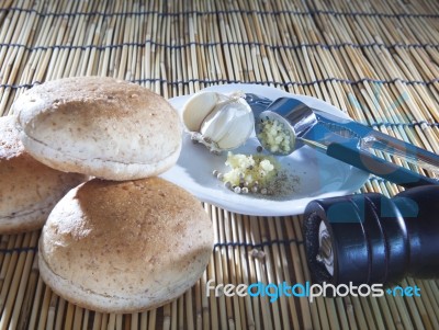 Burger Bun Bread Garlic And Pepper Crushed On Top Wood Table Stock Photo