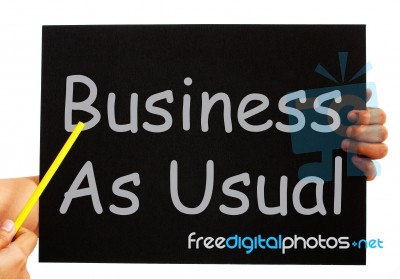 Business As Usual Blackboard Means Routine And Normality Stock Image