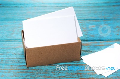 Business Cards In Paper Box On Wood Desk Stock Photo