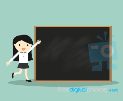 Business Concept, Business Woman Standing In Front Of Blackboard For Presentation Stock Image