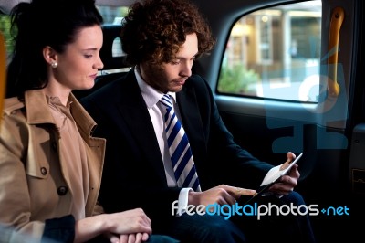 Business Execitives In Taxi Cab Stock Photo