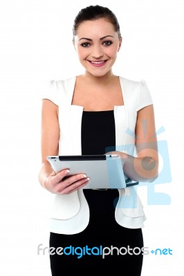 Business Executive Browsing On Tablet Device Stock Photo