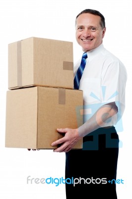 Business Executive Holding A Boxes Stock Photo