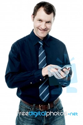 Business Executive Using His Cell Phone Stock Photo