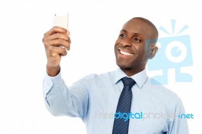 Business Executive Using Mobile Phone Stock Photo