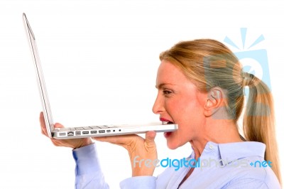 Business Lady Biting Laptop Stock Photo