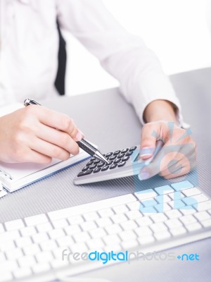 Business Lady Using Calculator Stock Photo