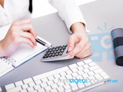 Business Lady Using Calculator Stock Photo