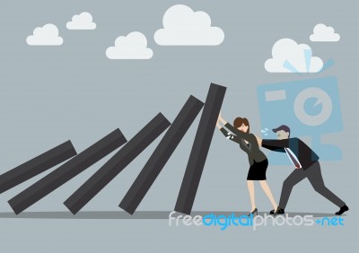 Business Man And Business Woman Pushing Hard Against Falling Dec… Stock Image