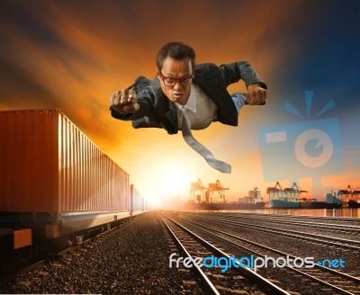 Business Man Flying Against Logistic Industry Background Stock Photo
